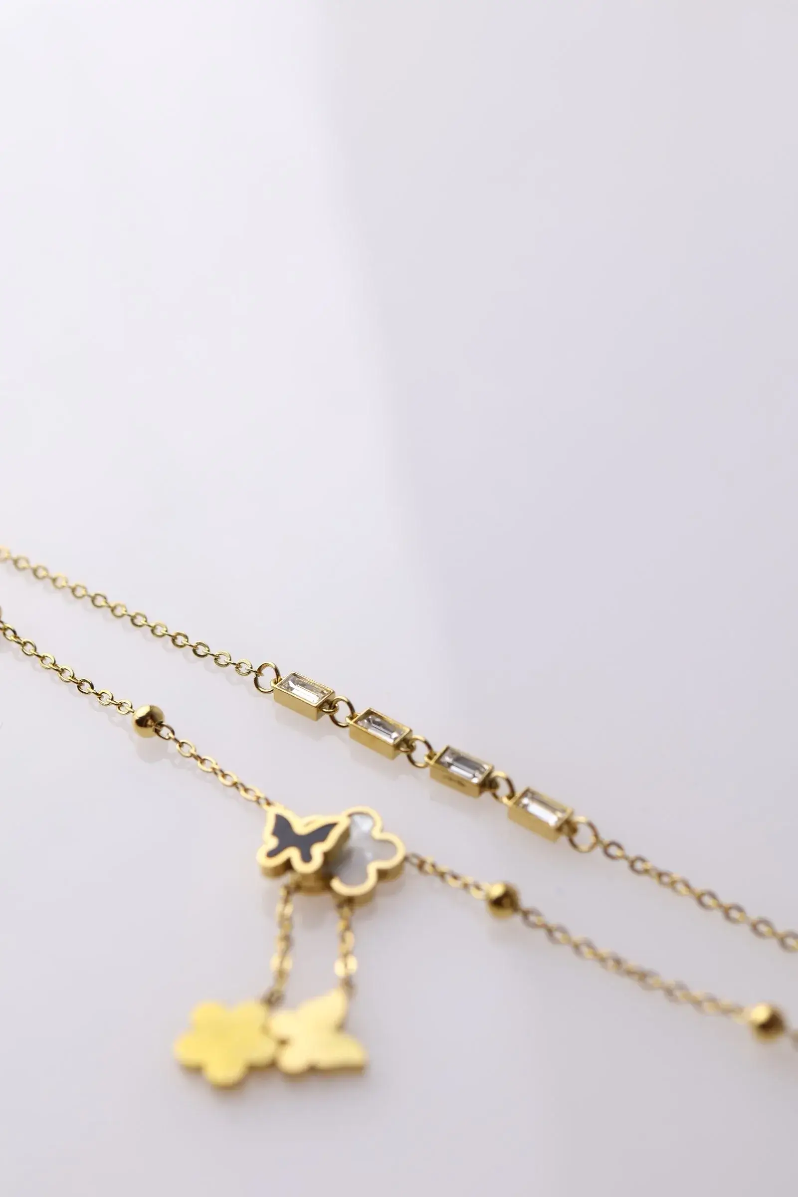 Anklet with 2 rounds of roses, butterfly pendants, and rounds of zirconium lobes - Image 3