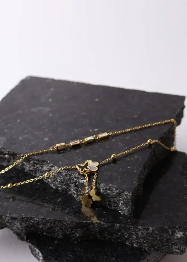 Anklet with 2 rounds of roses, butterfly pendants, and rounds of zirconium lobes