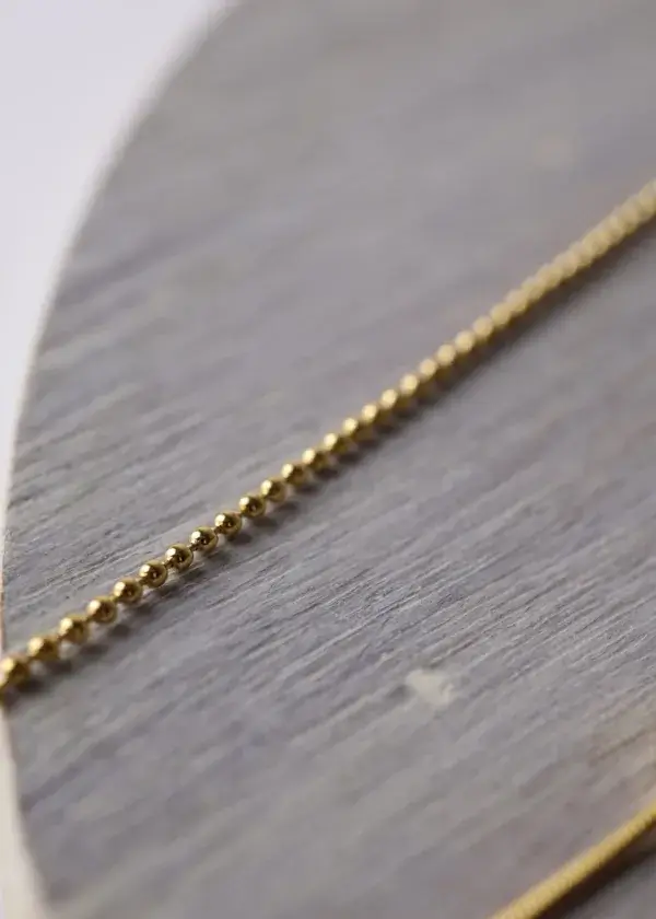 A delicate anklet, 2 turns, a chain turn with a hanger, and a small hummus turn