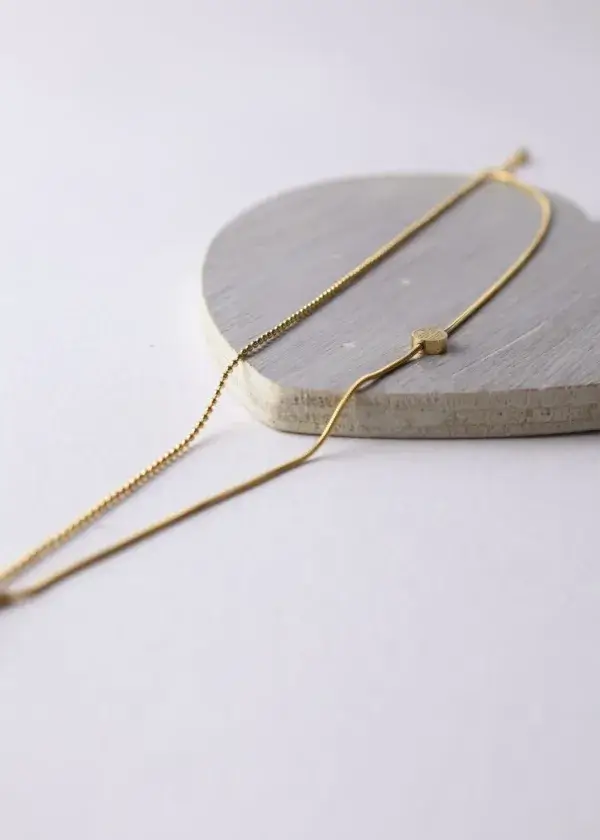 A delicate anklet, 2 turns, a chain turn with a hanger, and a small hummus turn