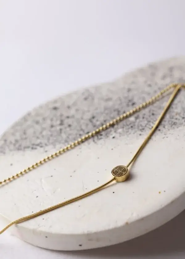 A delicate anklet, 2 turns, a chain turn with a hanger, and a small hummus turn