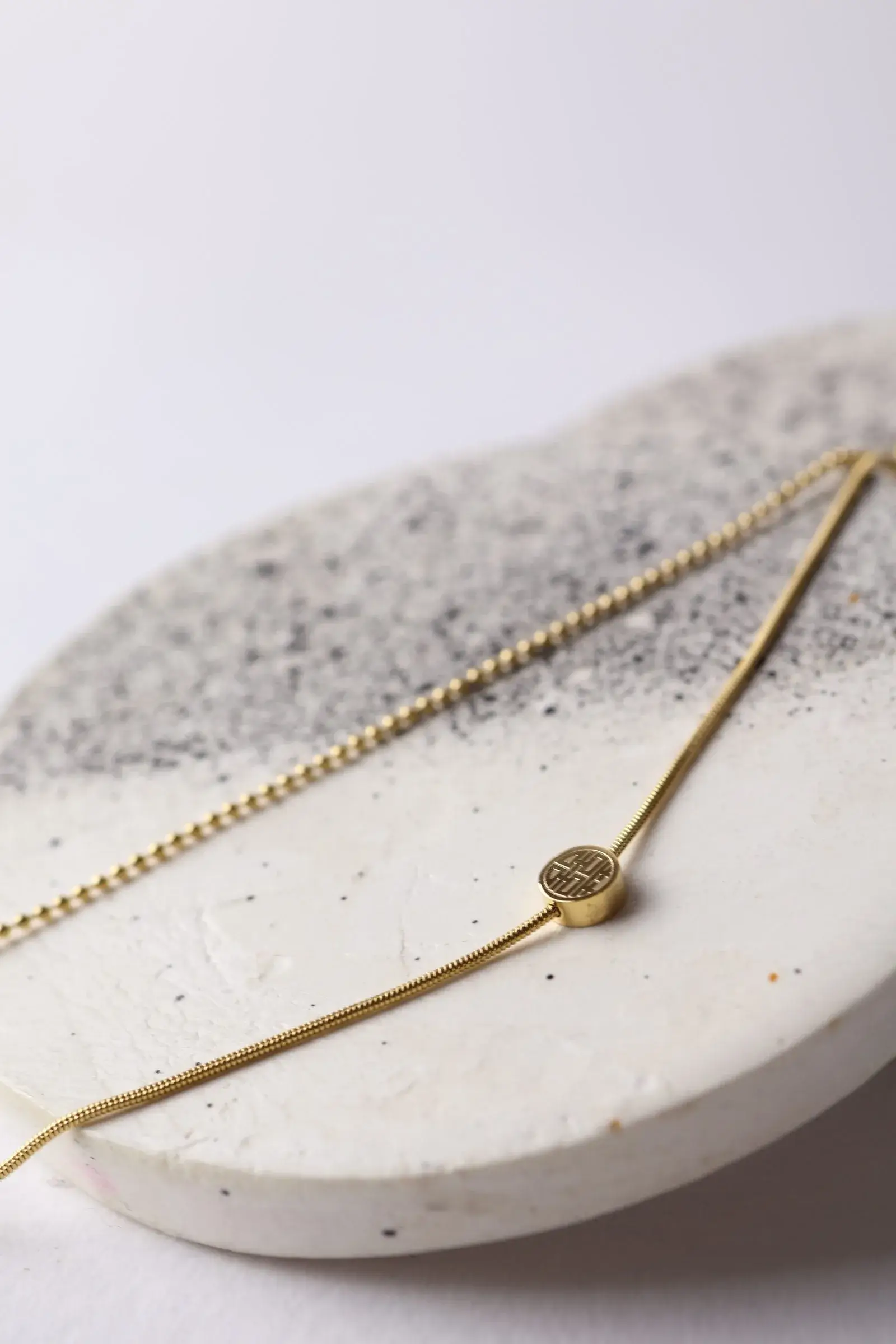 A delicate anklet, 2 turns, a chain turn with a hanger, and a small hummus turn