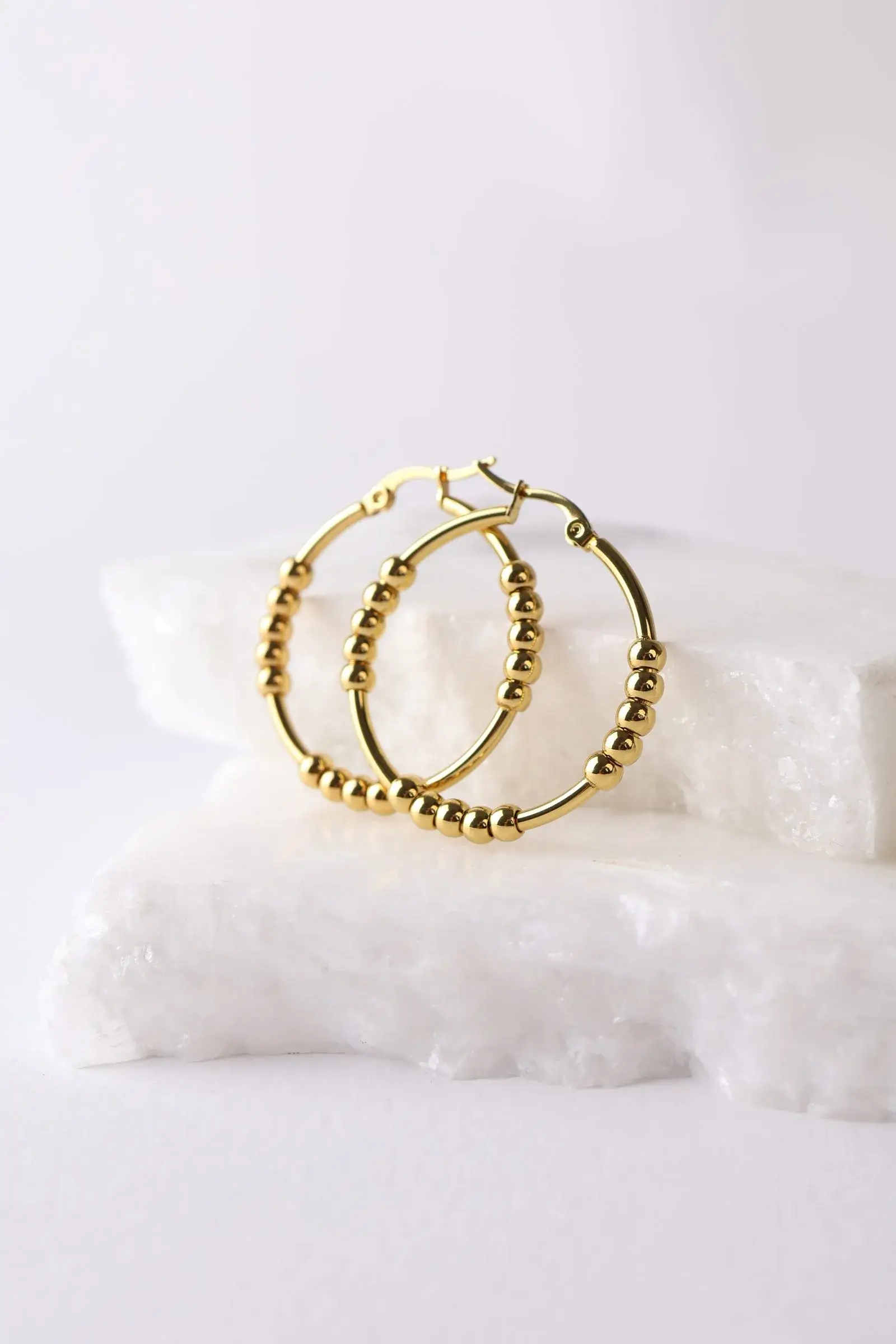 Circular earring with chickpeas, diameter 3 cm