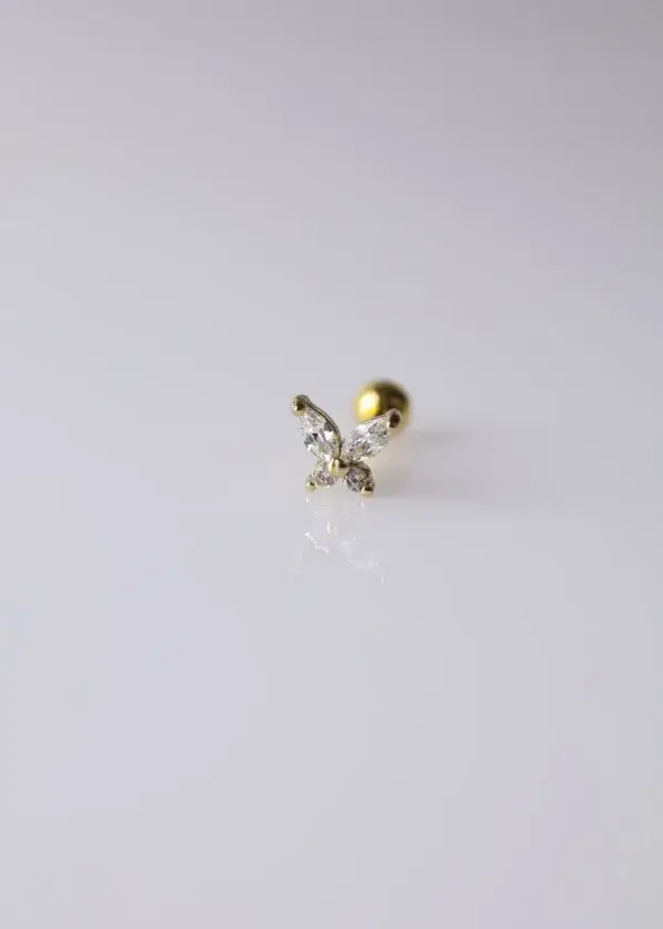 Ear piercings with zirconium lobes in the shape of a butterfly