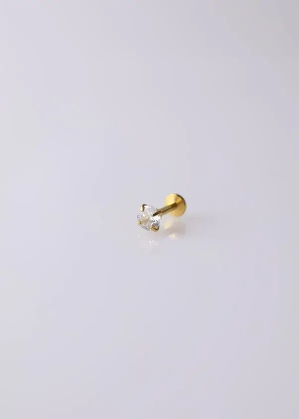 Piercing ear with zircon