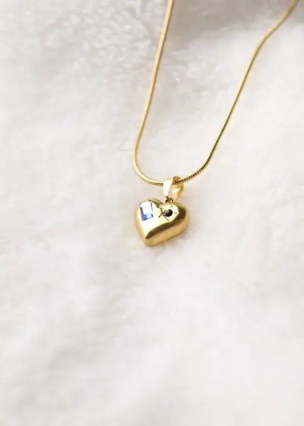 A heart chain with a rectangular zircon stone and an engraved star