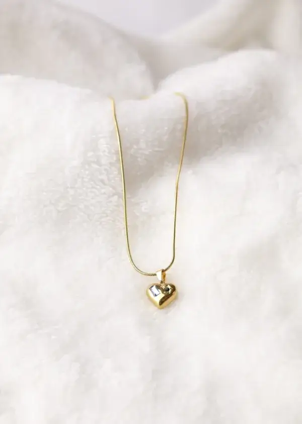 A heart chain with a rectangular zircon stone and an engraved star