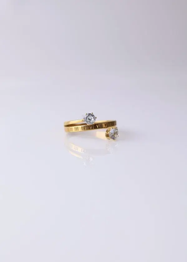 Open ring with Latin numbers and two zirconium lobes